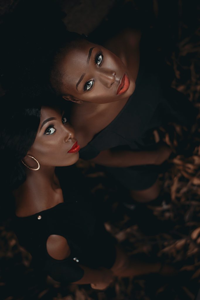 Talked my friends into getting in front of my lens to model for me sometime earlier on in my Photography career when I was trying to put together a portfolio in 2019. The pictures turned out to be some of my personal faves till date in my portfolio.
______________________
Portrait of black African young women in black gowns with afro hairstyle standing together. African female models looking at the camera.